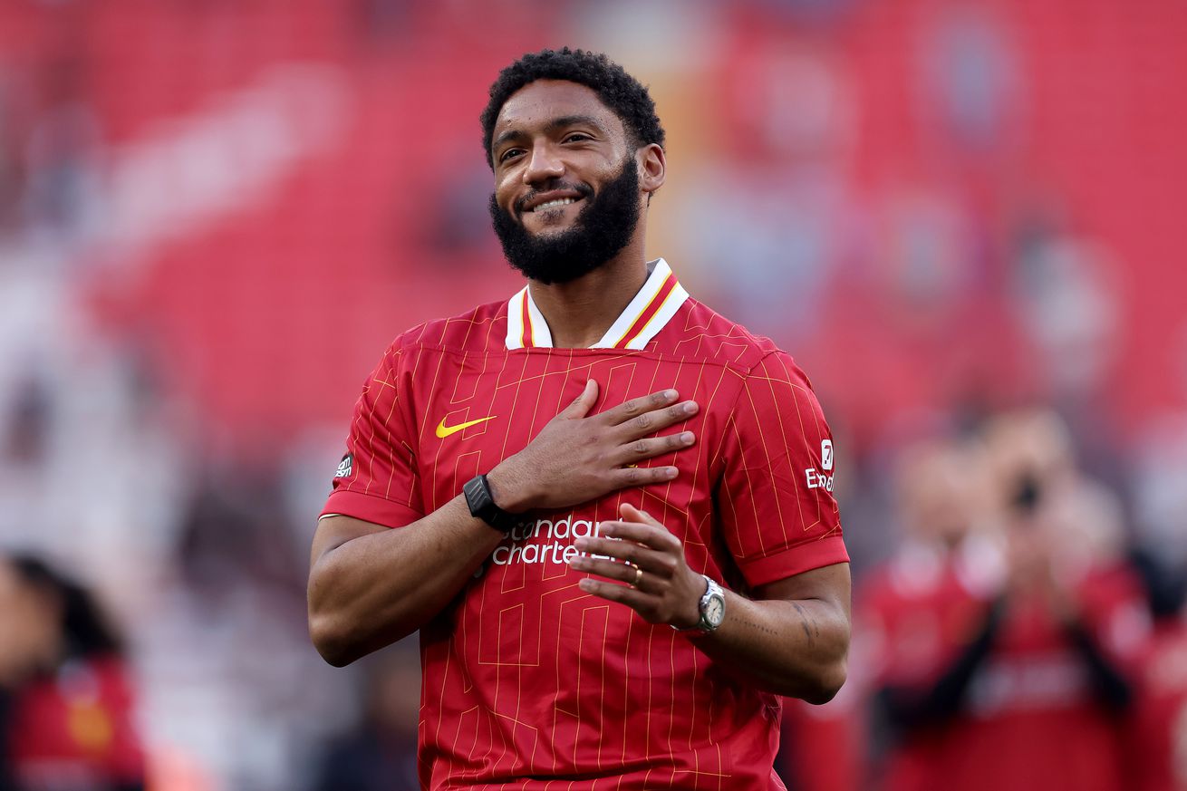 Joe Gomez of Liverpool celebrates the teams victory and confirmation of winning the Premier League title after the Premier League match between Liverpool FC and Tottenham Hotspur FC at Anfield on April 27, 2025 in Liverpool, England.