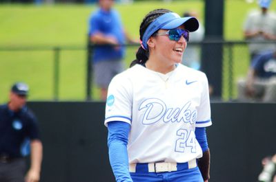 Duke infielder Thessa Malau’ulu smiles after a conversation with her pitcher during the regional round of the NCAA Softball Tournament against Howard on Friday, May 16, 2025, in Durham, North Carolina.